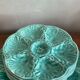 Flat oyster service and 6 splash plates of Gien green celadon