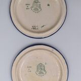 A flat bottom and two enamel bottle bottoms of Longwy