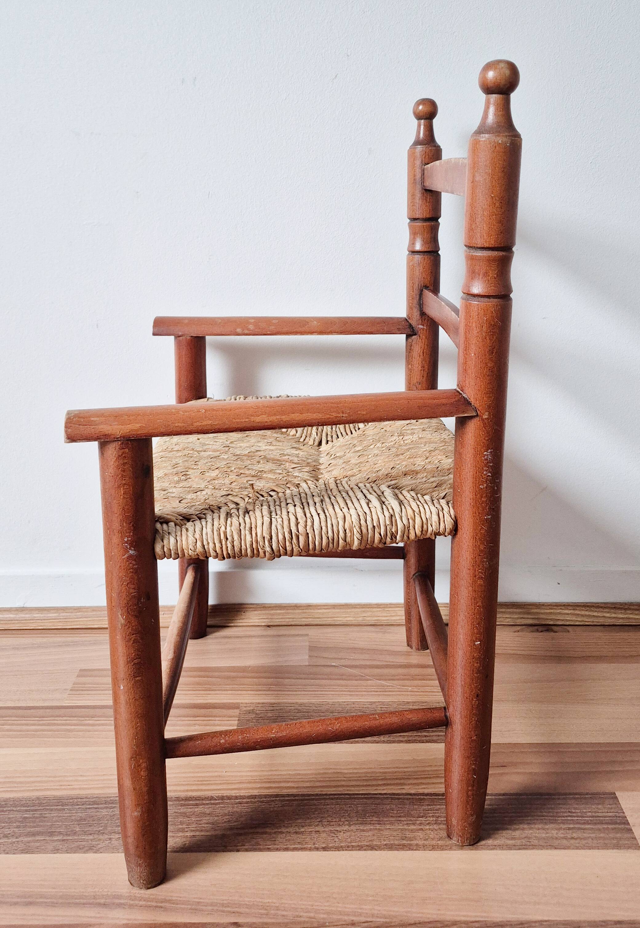 Vintage wooden and straw children's armchair