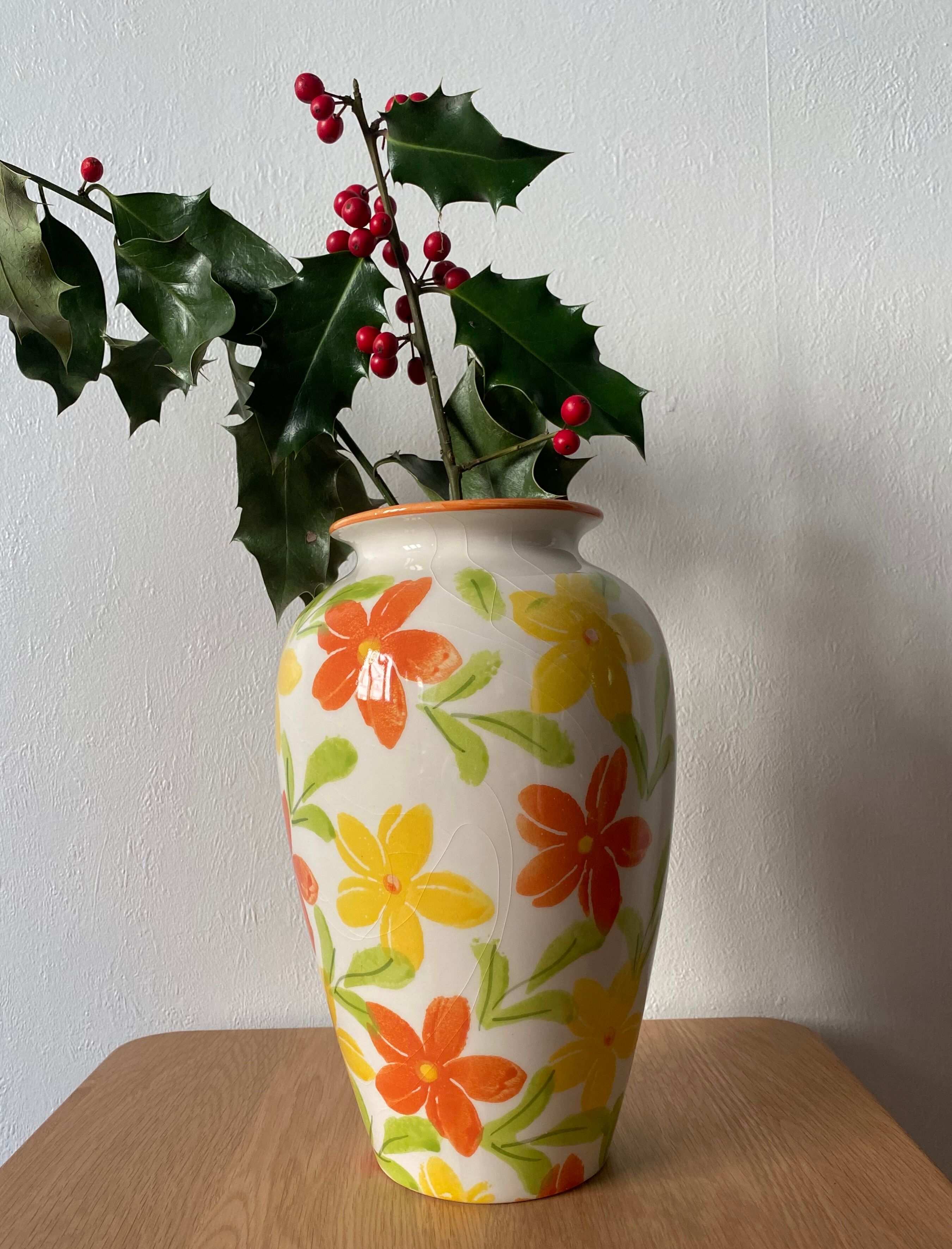 White vase with flowers