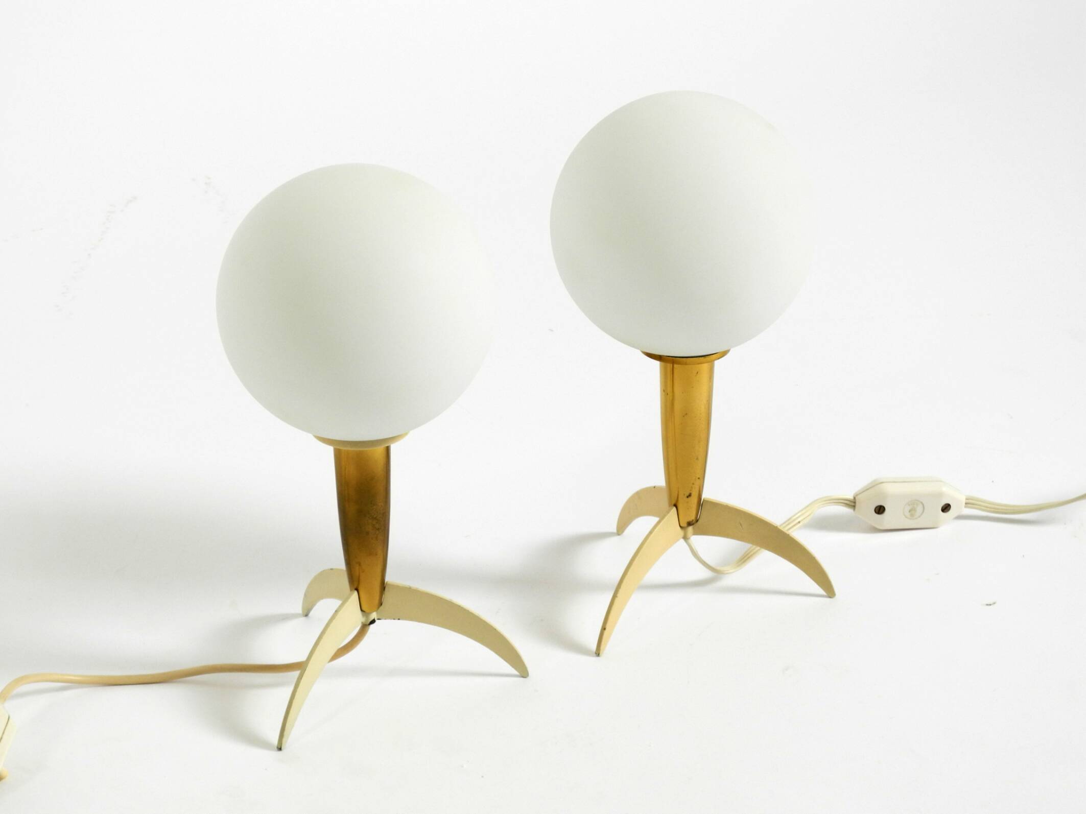 Two Mid-Century Modern rocket table lamps in brass and glass