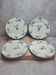 Set of 4 antique dessert plates in ironstone, with blue and green floral decoration.