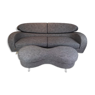 Two seater sofa of grey wool fabric with stool by the norwegian brand Brunstad