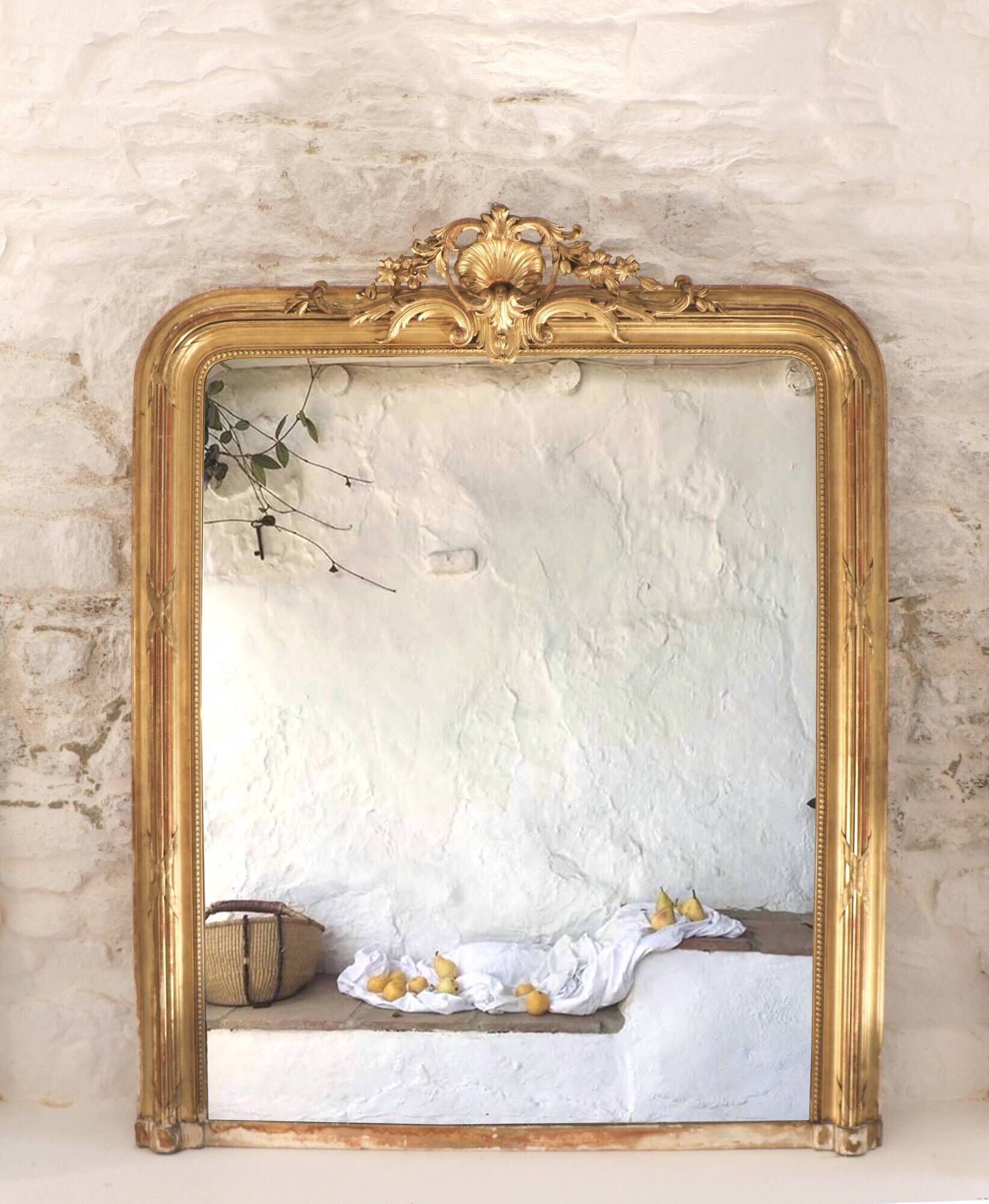 Manor house trumeau mirror in gilded wood, 19th century