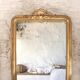 Manor house trumeau mirror in gilded wood, 19th century