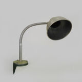 Old industrial articulated lamp with vice. Year 50