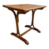 Small side table or bistro serving table with curved wood.