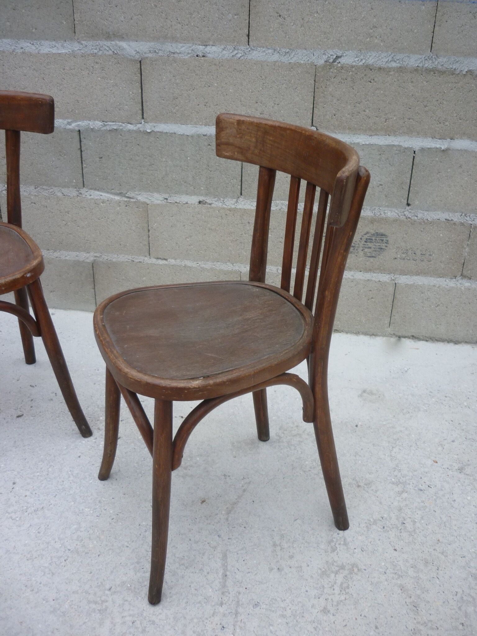Pair of old bistro chairs with dark patina