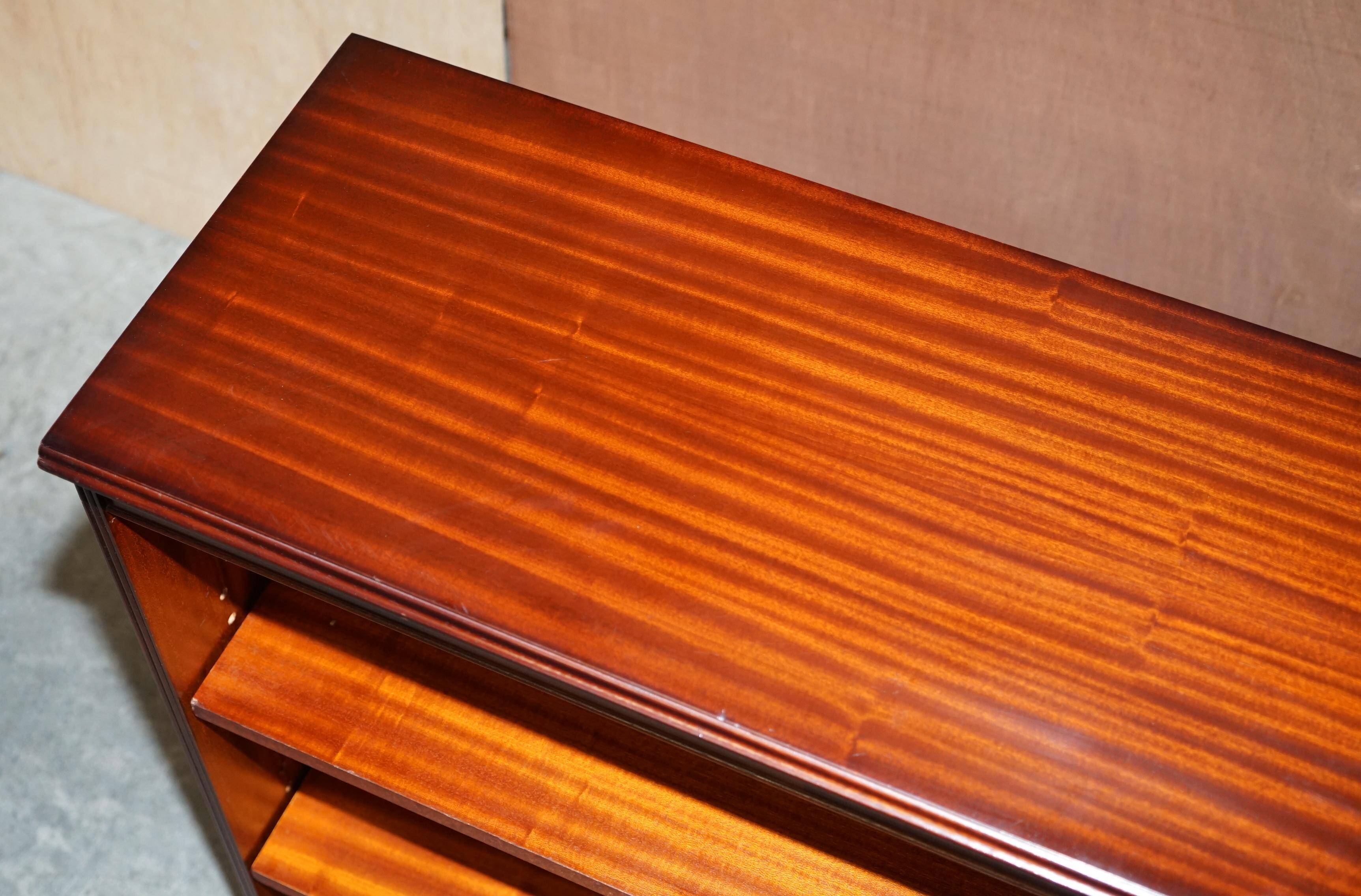 Pair of open low bookshelves Shaws of London in hardwood.