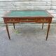 Louis XVI style desk in mahogany with a green leather top.