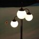 Minimalist floor lamp in glass, space age style.