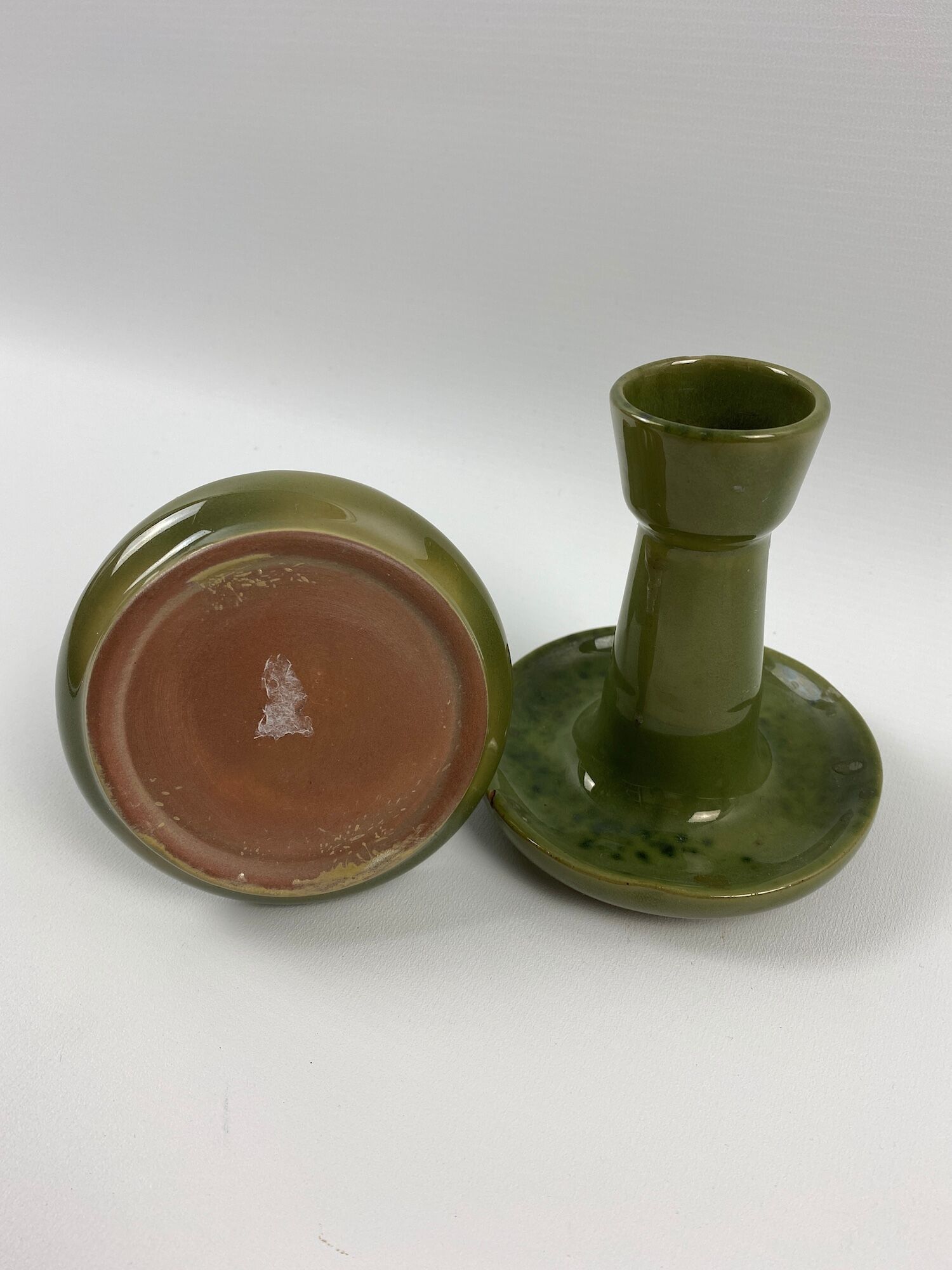 2 green coloured terracotta candlesticks