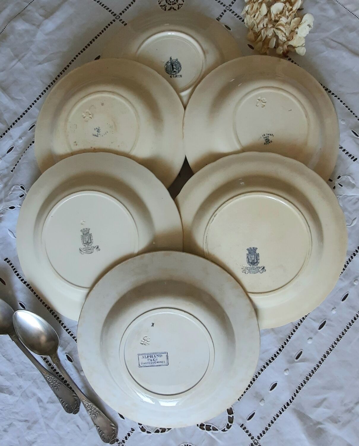 Old mismatched hollow plates in iron earth earthenware