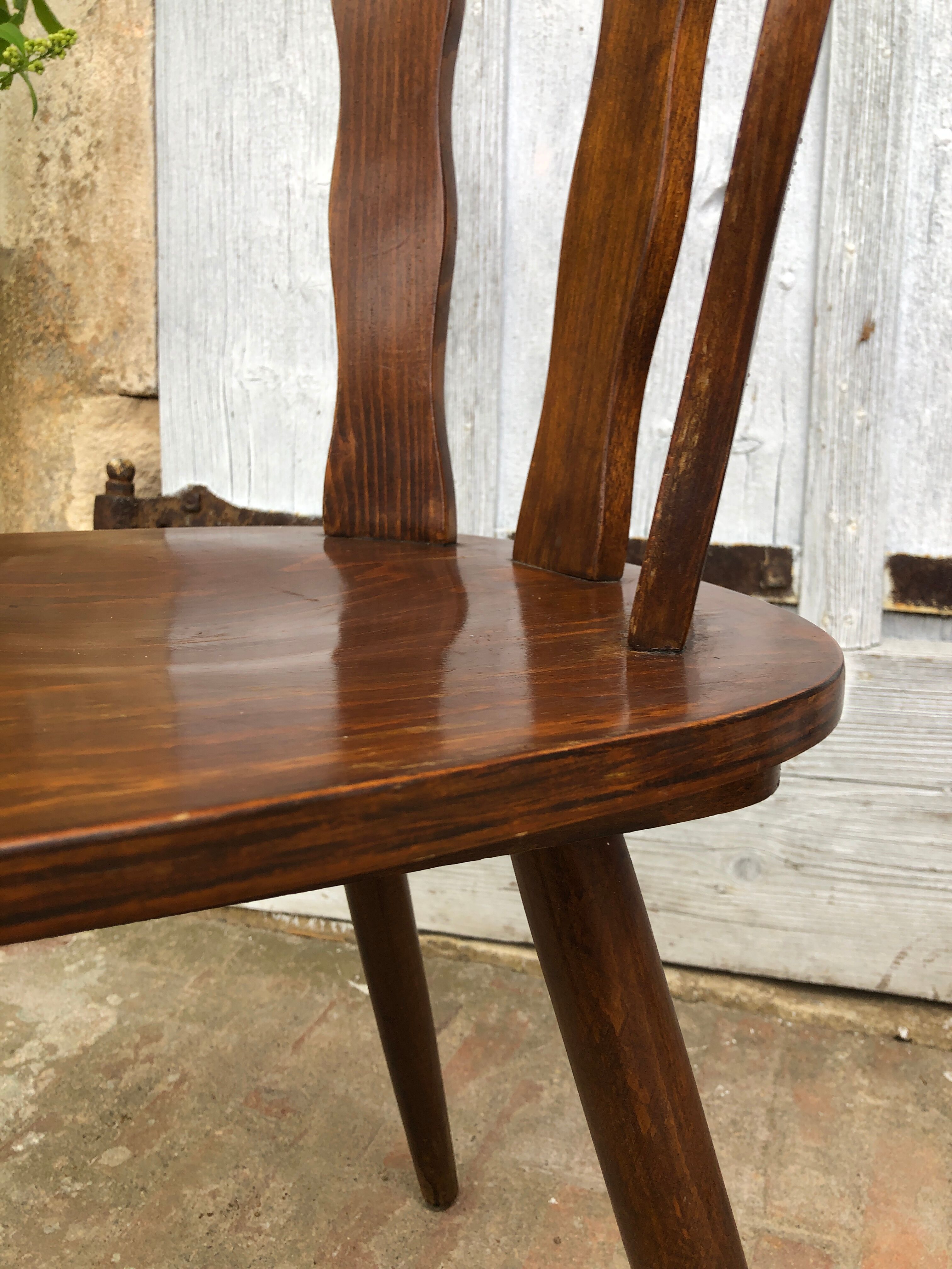 4 brutalist-style wooden chairs