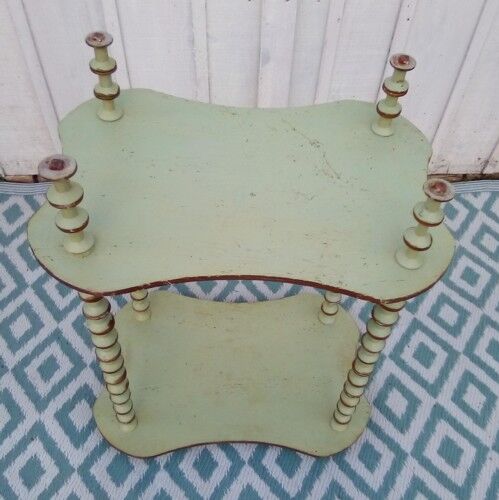 Shelf coils monogrammed patinated wood