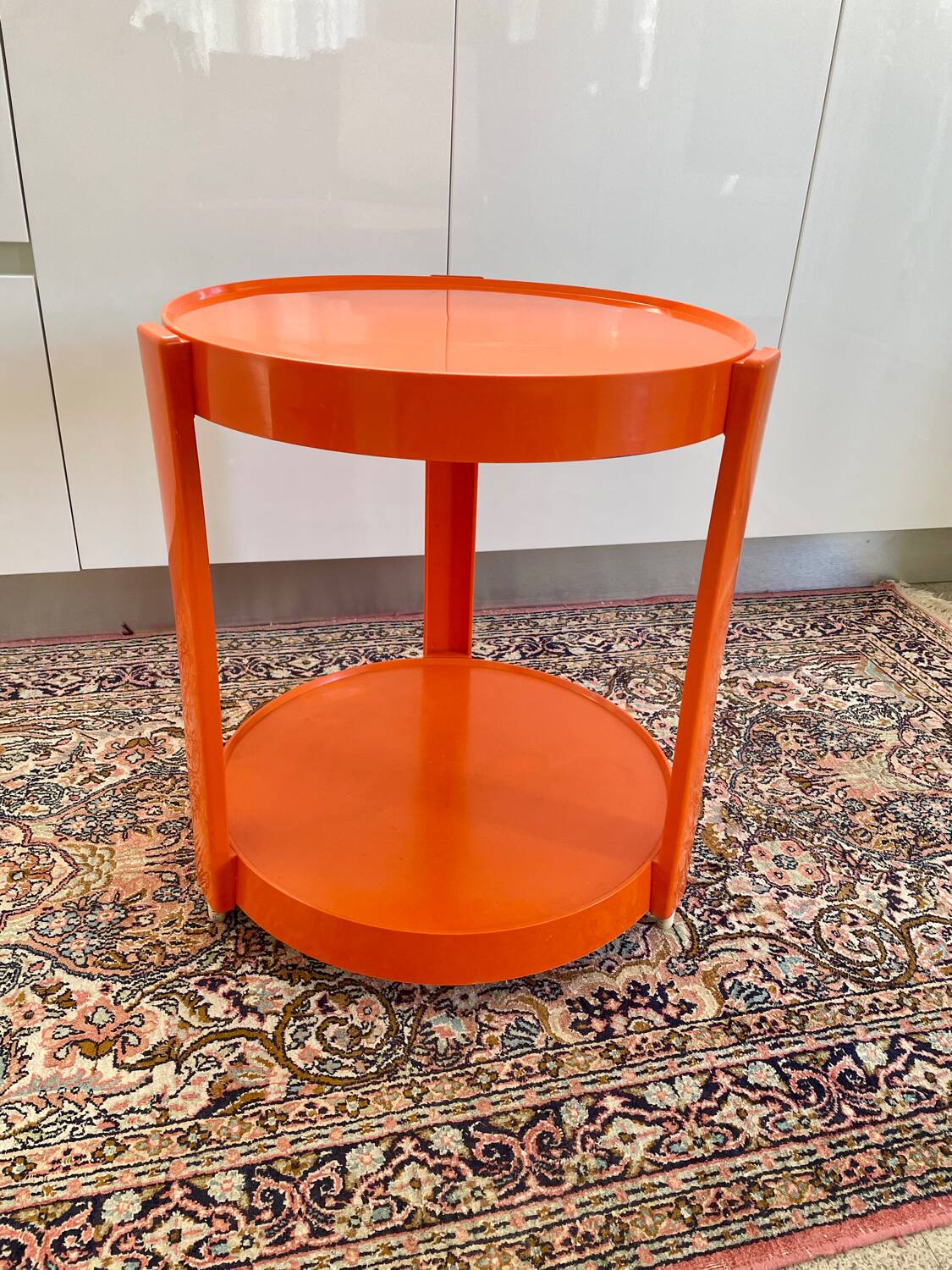 Round orange plastic side table 1970