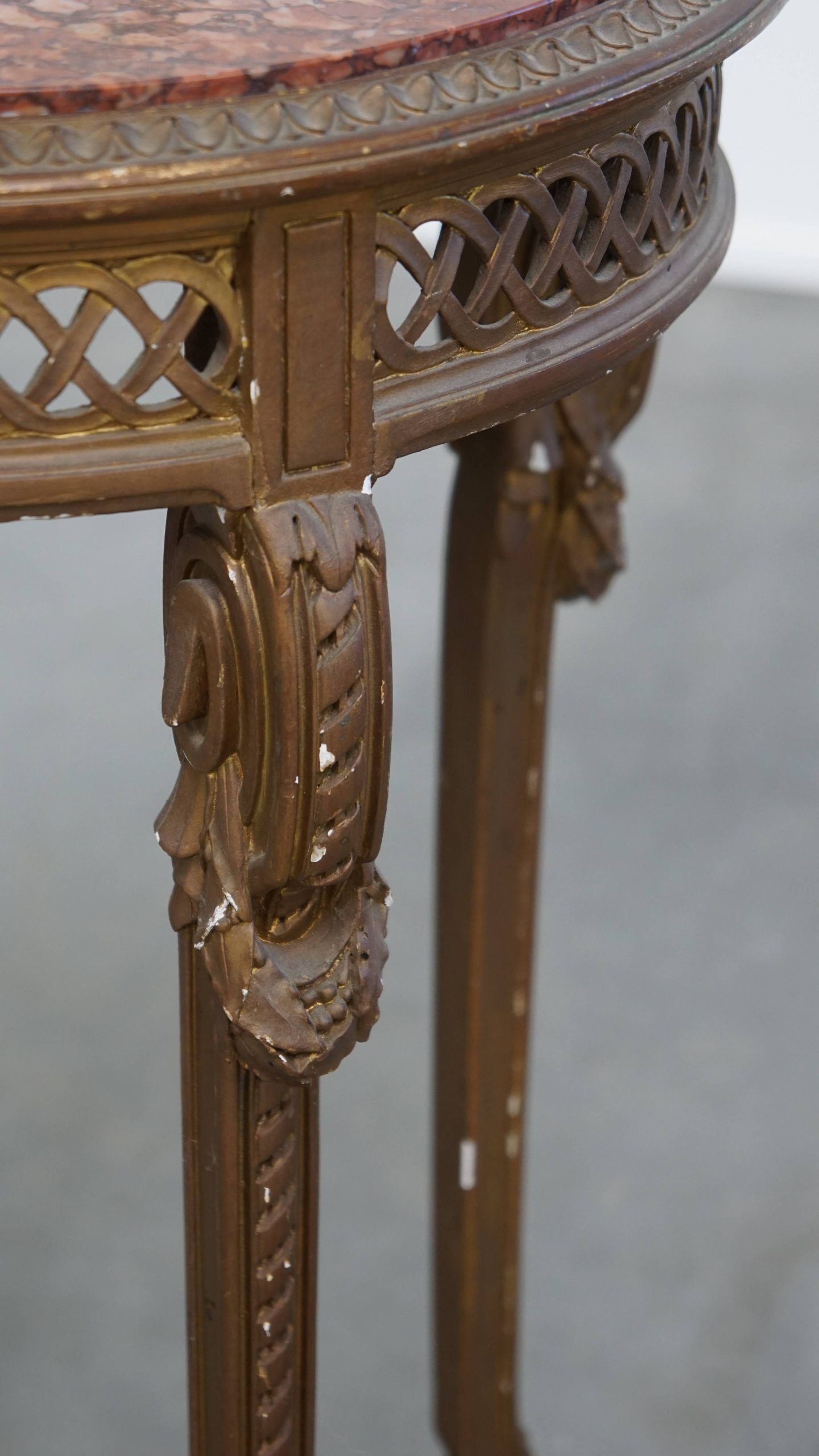 Antique French side table with a gold-coloured wooden frame and marble top