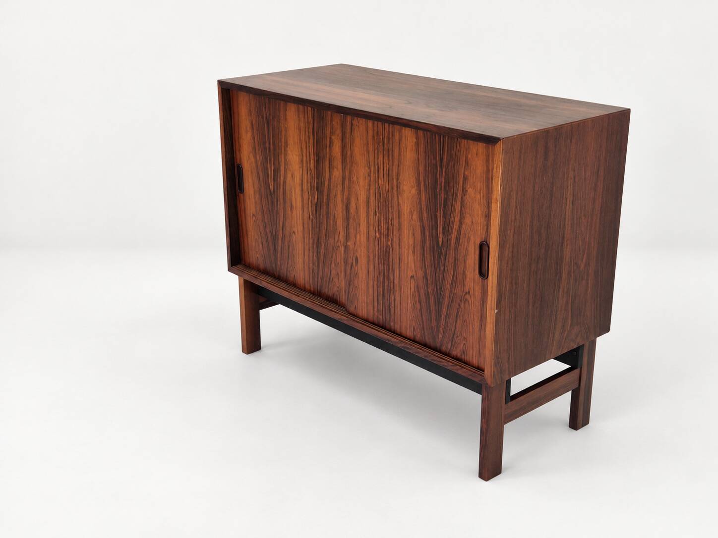 Low sideboard in rosewood with sliding doors. Denmark, 1960s
