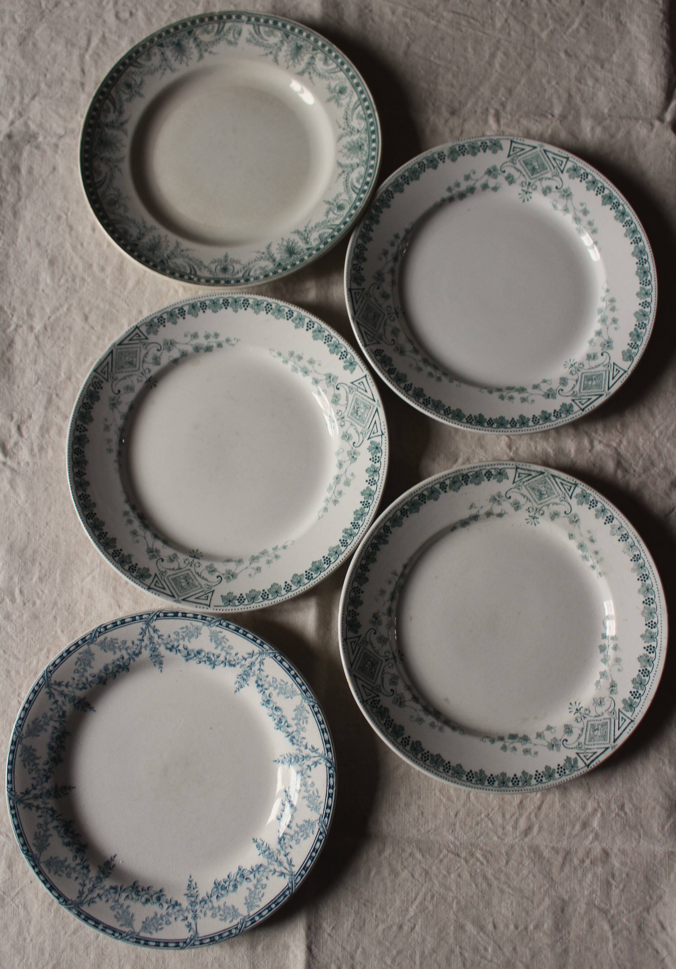 A set of 5 mismatched green blue Terre de fer flat plates