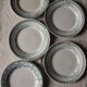 A set of 5 mismatched green blue Terre de fer flat plates