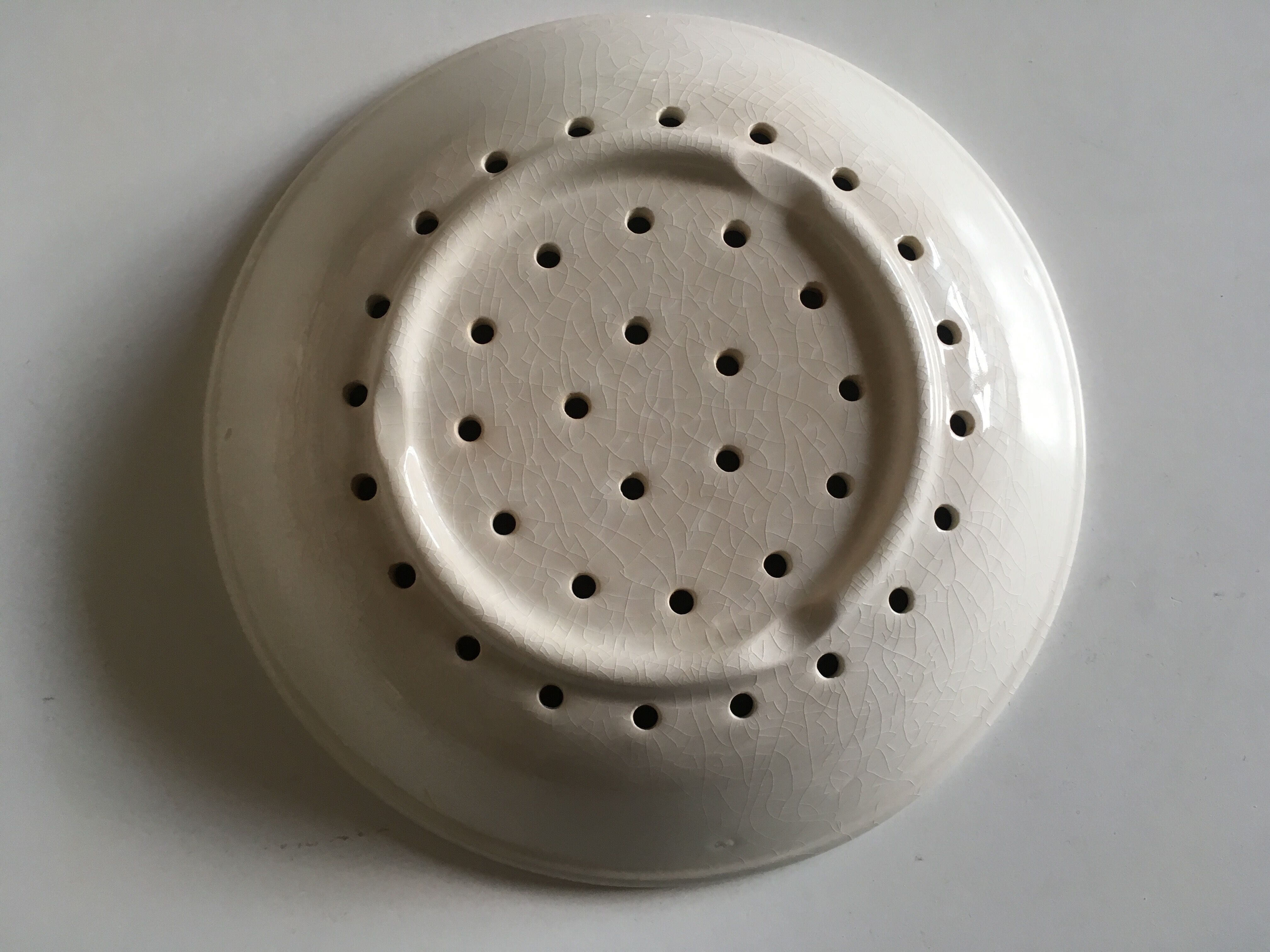 Perforated pheasant plate in 1900s iron earth