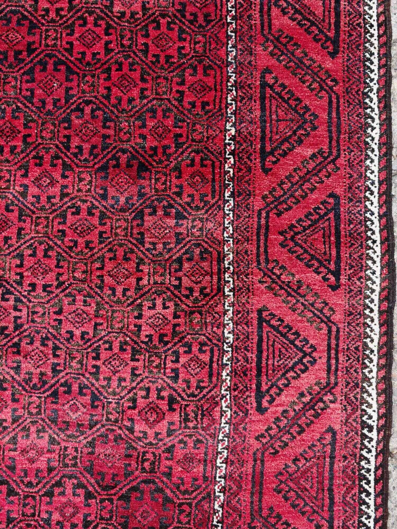 Vintage handmade Baluch rug with geometric pattern from the 1950s.