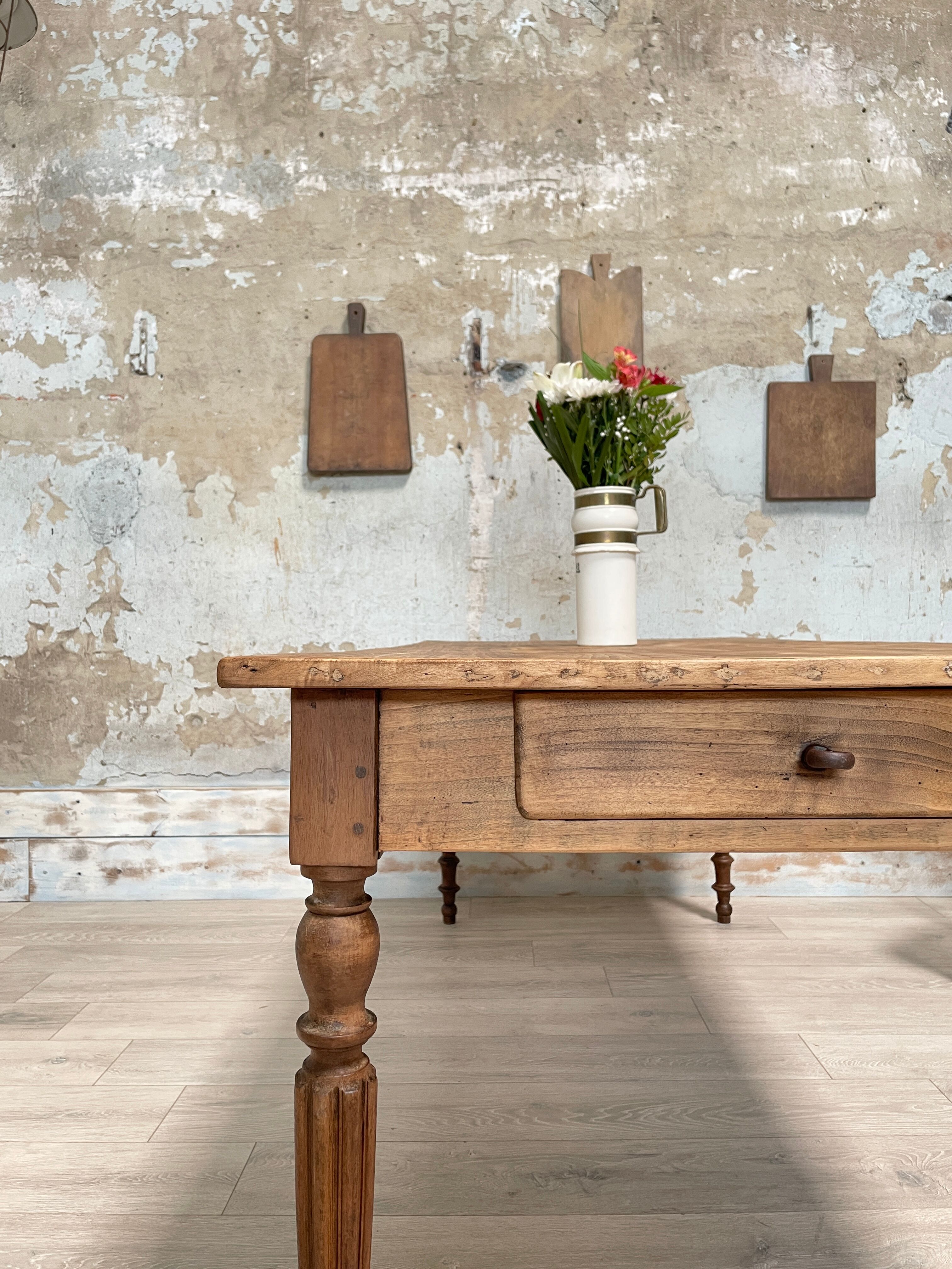 Vintage farmhouse table with turned legs.