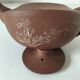 Japanese teapot in red clay engraved with integrated filter.