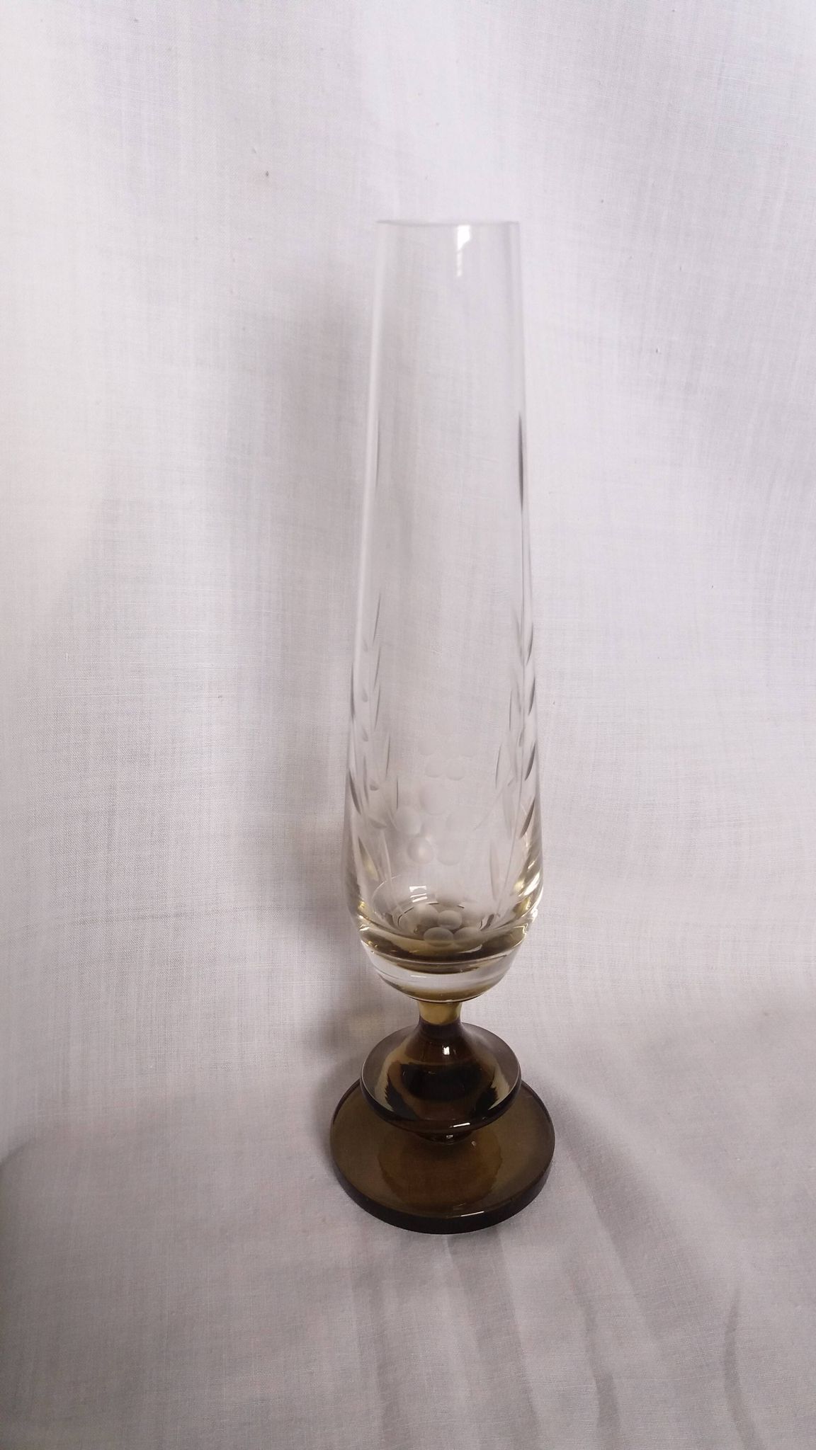 Cut glass soliflore vase with a smoked glass base.