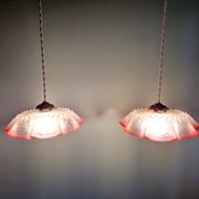 Pair of clear and pink satin glass scalloped pendant lights, 1920s-30s