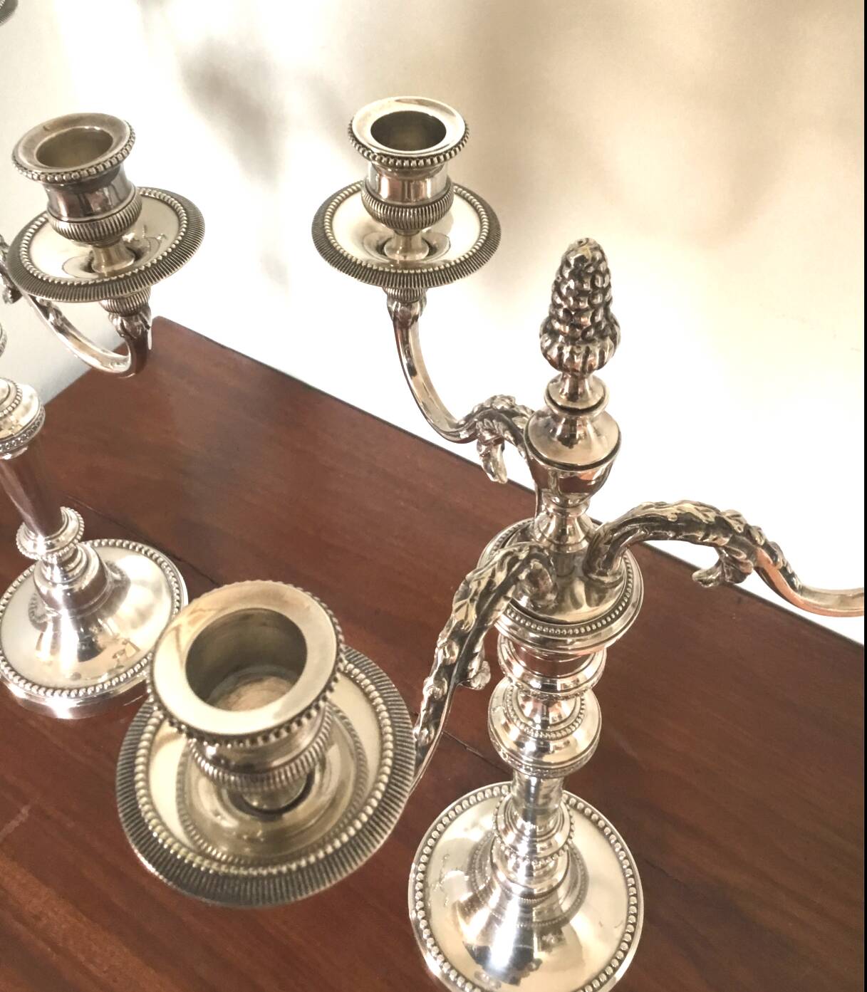 Pair of Louis XVI style silver-plated metal candelabras. Chrysalia house