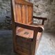Rustic French antique storage bench from the 18th century in walnut and pine.