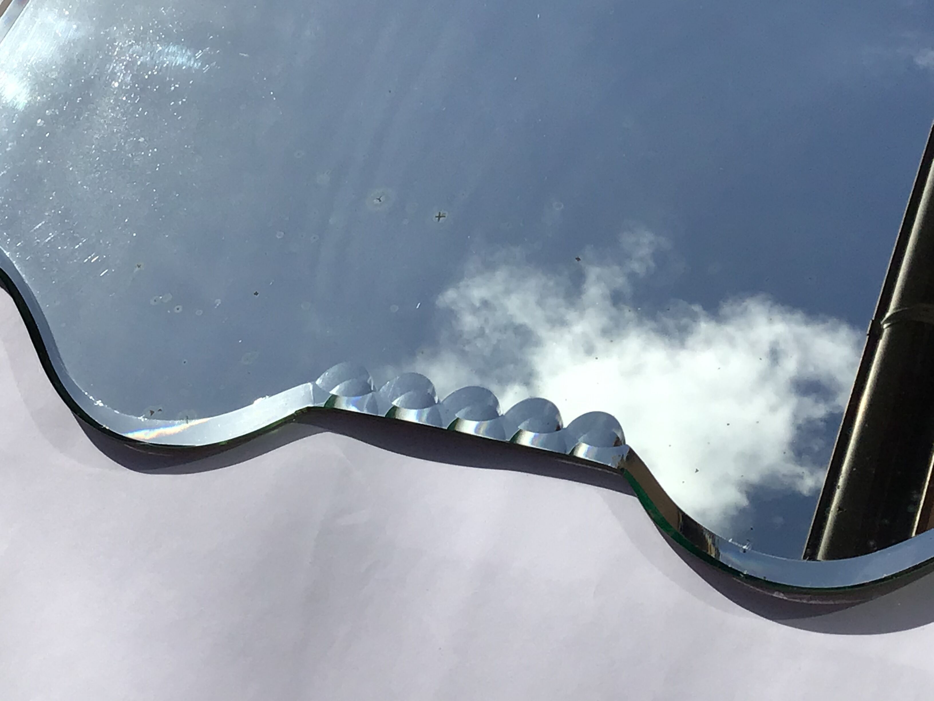 Bevelled mirror trapeze two waves at the top