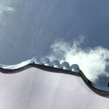 Bevelled mirror trapeze two waves at the top