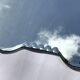 Bevelled mirror trapeze two waves at the top