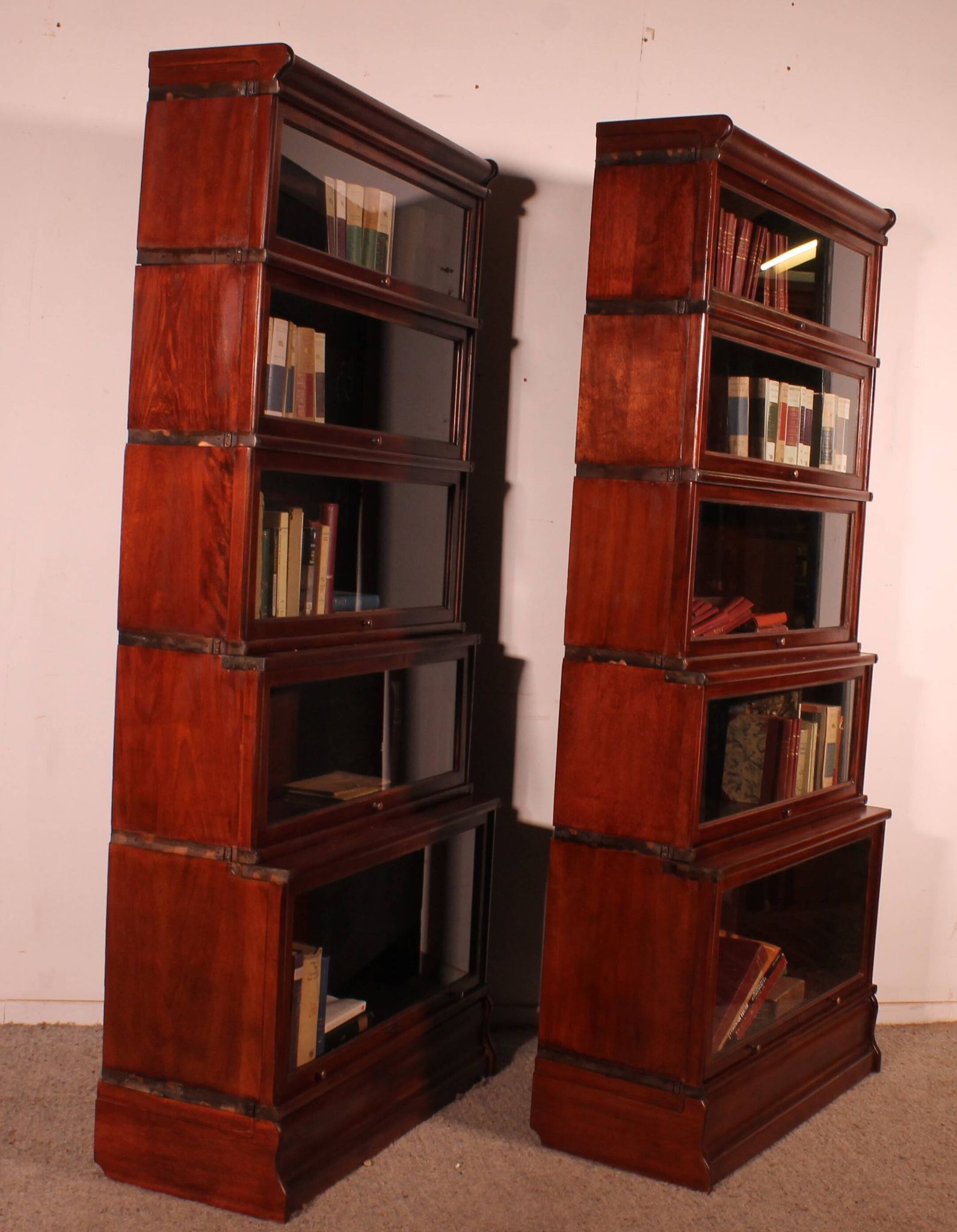 pair of Globe Wernicke London 'waterfall' bookcases in mahogany circa