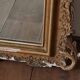 Antique Louis Philippe mirror with a pediment.