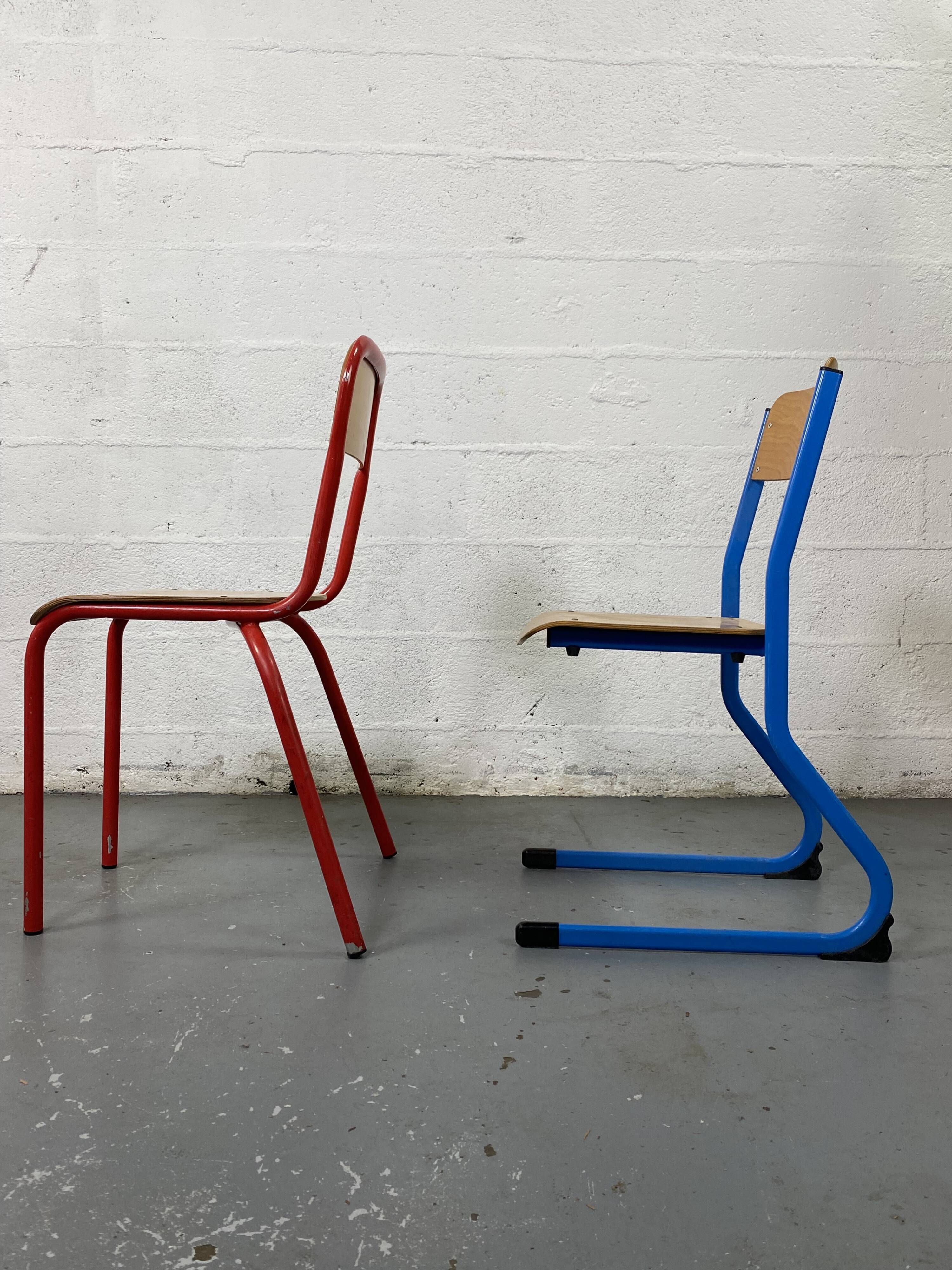 Set of 2 mismatched industrial school chairs