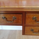 English wooden desk on top of leather