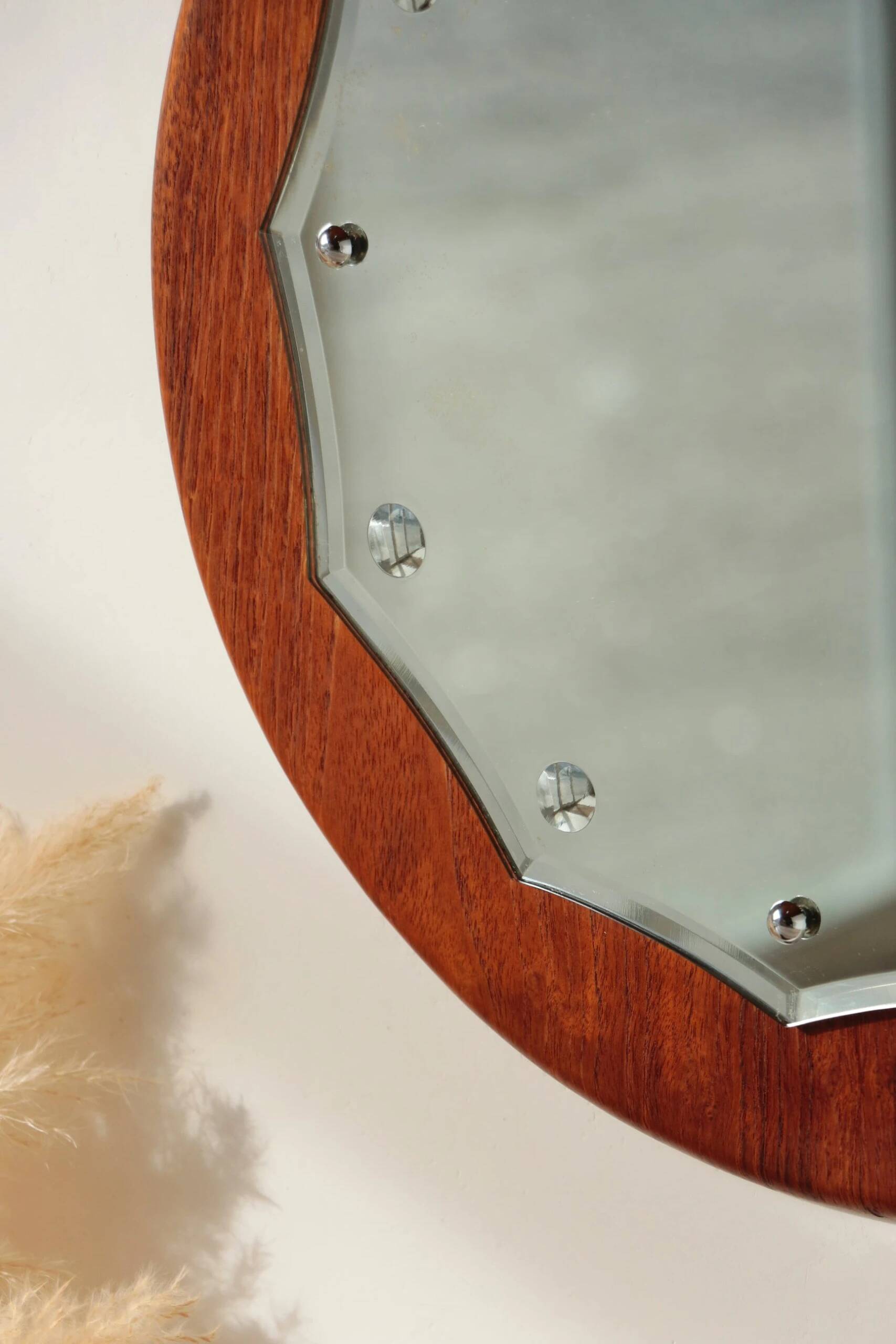 Vintage round teak mirror from the 1960s.