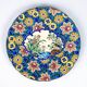Assiette Longwy 1930 – Émaux à décor d’oiseaux et fleurs oranges