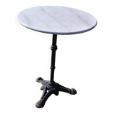 Marble bistro table with cast iron legs in Parisian café style