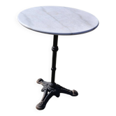 Marble bistro table with cast iron legs in Parisian café style