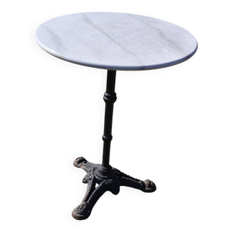Marble bistro table with cast iron legs in Parisian café style