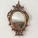 Old mirror in gilded wood 17x12cm