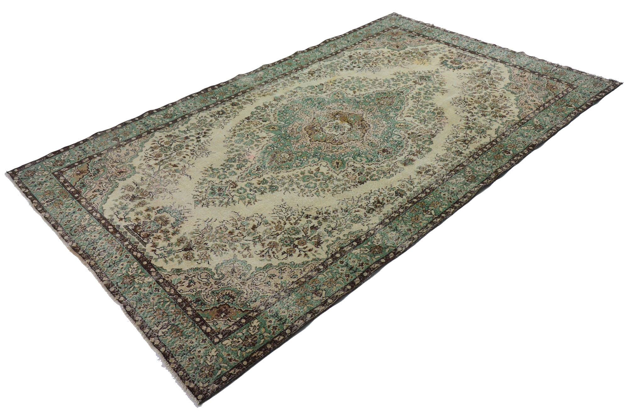 Vintage Oushak rug with green and beige medallion, 345 x 205 cm.