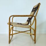 Rattan armchair and fabric, France 60s