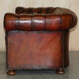 Pair of restored antique Chesterfield sofas in Boudreaux leather.