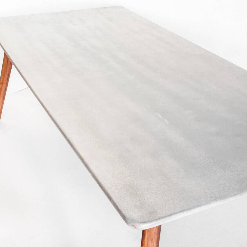 Scandinavian style dining table. Polished and varnished wood and concrete. For indoor or outdoor use.