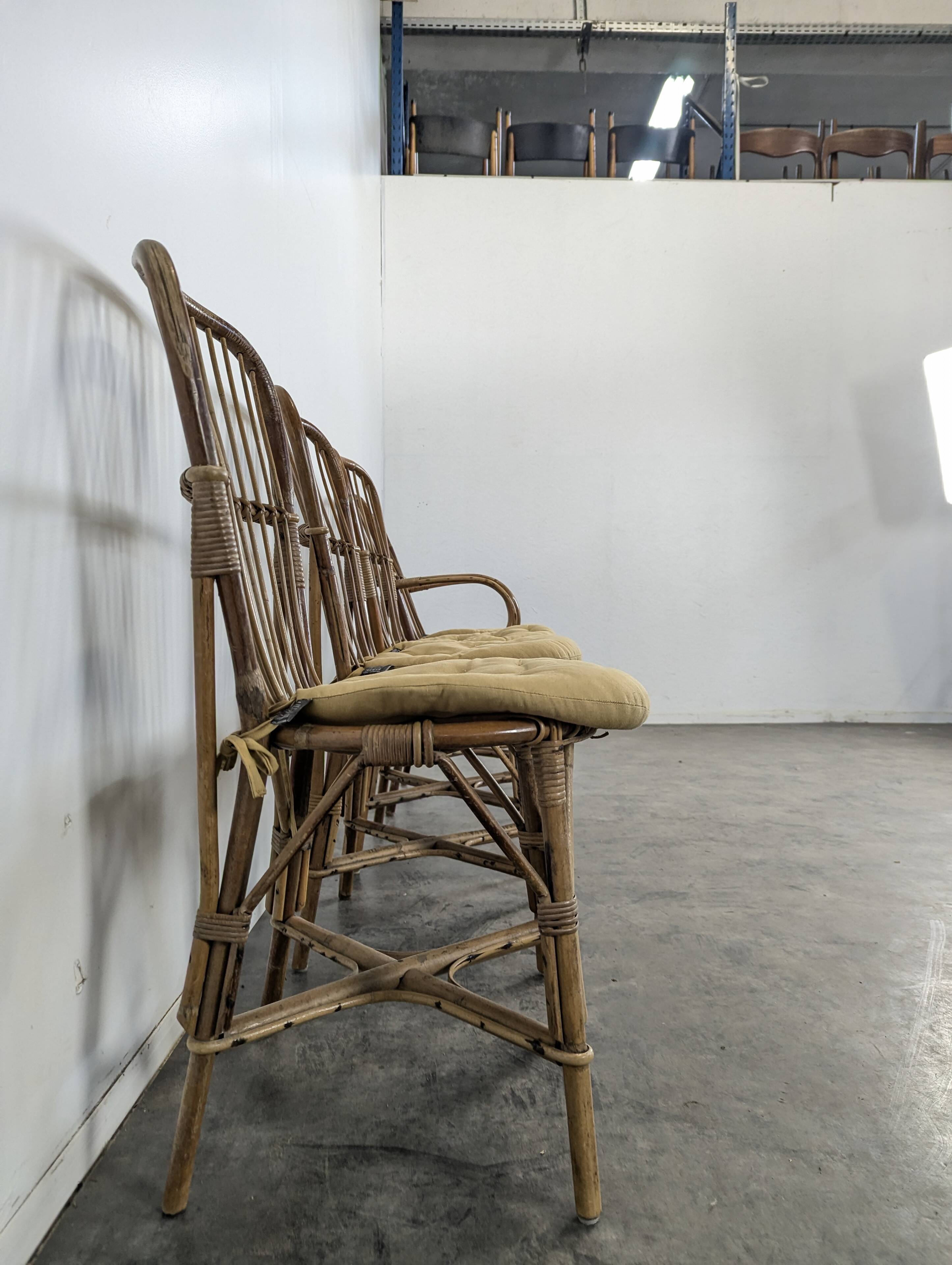 Set of 3 chairs and a rattan armchair.